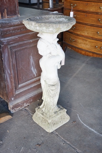 A reconstituted stone figural garden bird bath, height 89cm